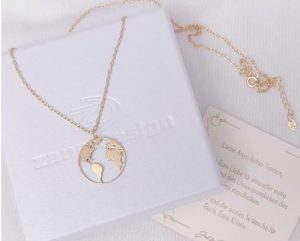 Necklace with a pendant of a world map