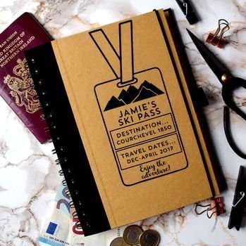 A travel notebook with ski pass design