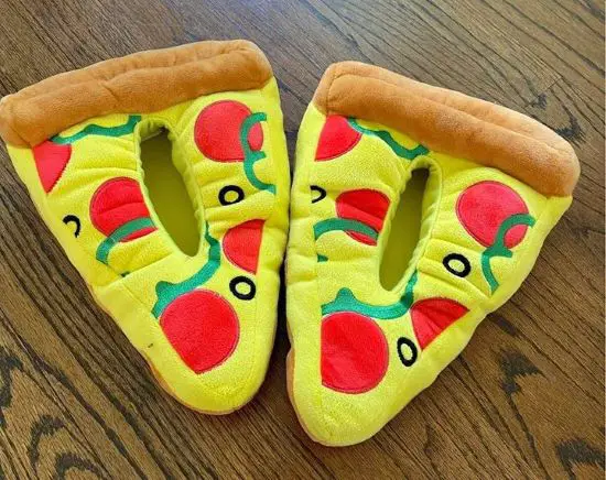 A pair of warm slippers that look like slices of pizza