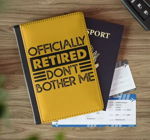 A passport cover with the text Öfficially retired, don't bother me"