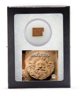 A framed specimin of a brick from an ancient Roman bath