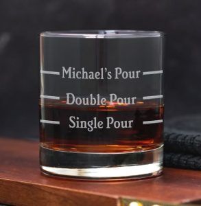 A personalized glass with strips indicating a single and double pour and "Michael's Pour"