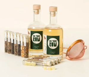 A DIY rum infusion set with botanicals and glass bottles