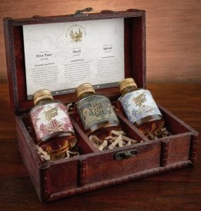 A treasure chest with three bottlles of rum