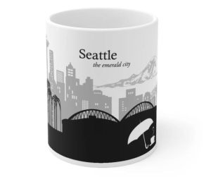 A white mug with the skyline of Seattle