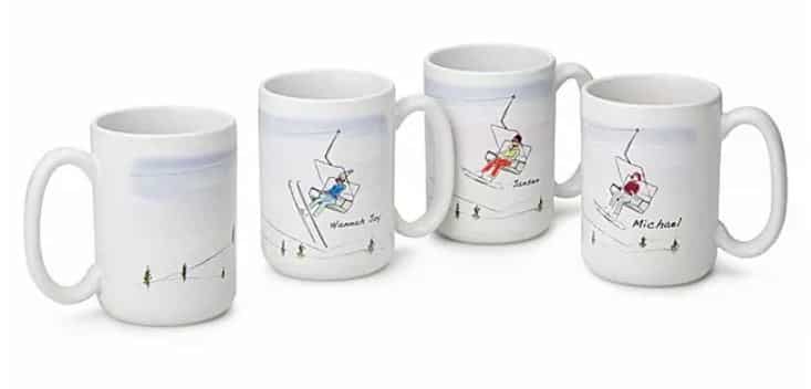 Four mugs with drawings of people in ski lifts