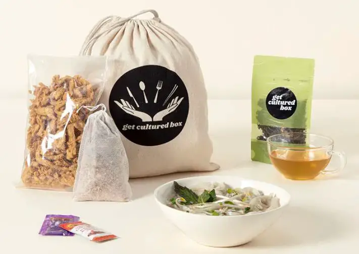 Bowl of soup and ingredients in bags