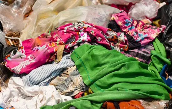 Pile of old clothes that can be reused as sustainable gift wrap