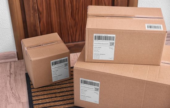 Shipping boxes in front of a door