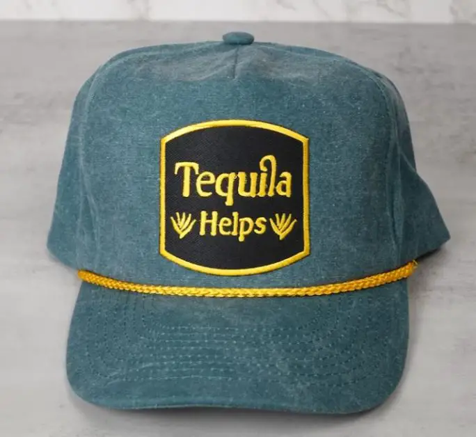 Hat with text: tequila helps