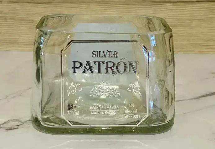 A glass bowl made from a recycled Patron tequila bottle
