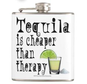 A silver flask with a funny tequila text