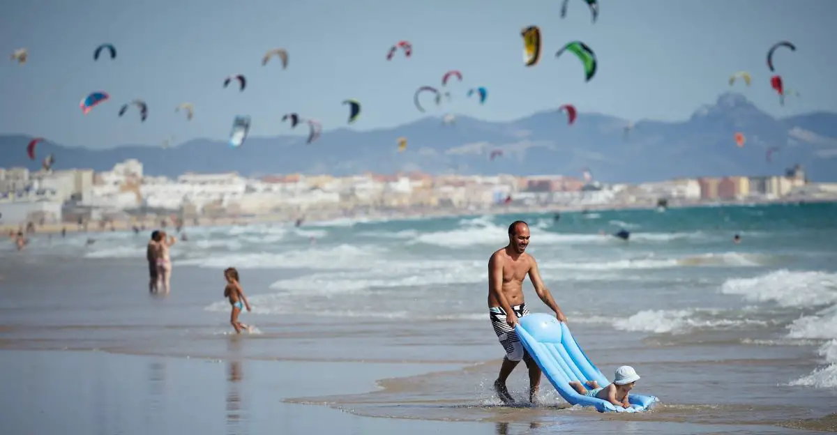 Dad playing with child on the beach