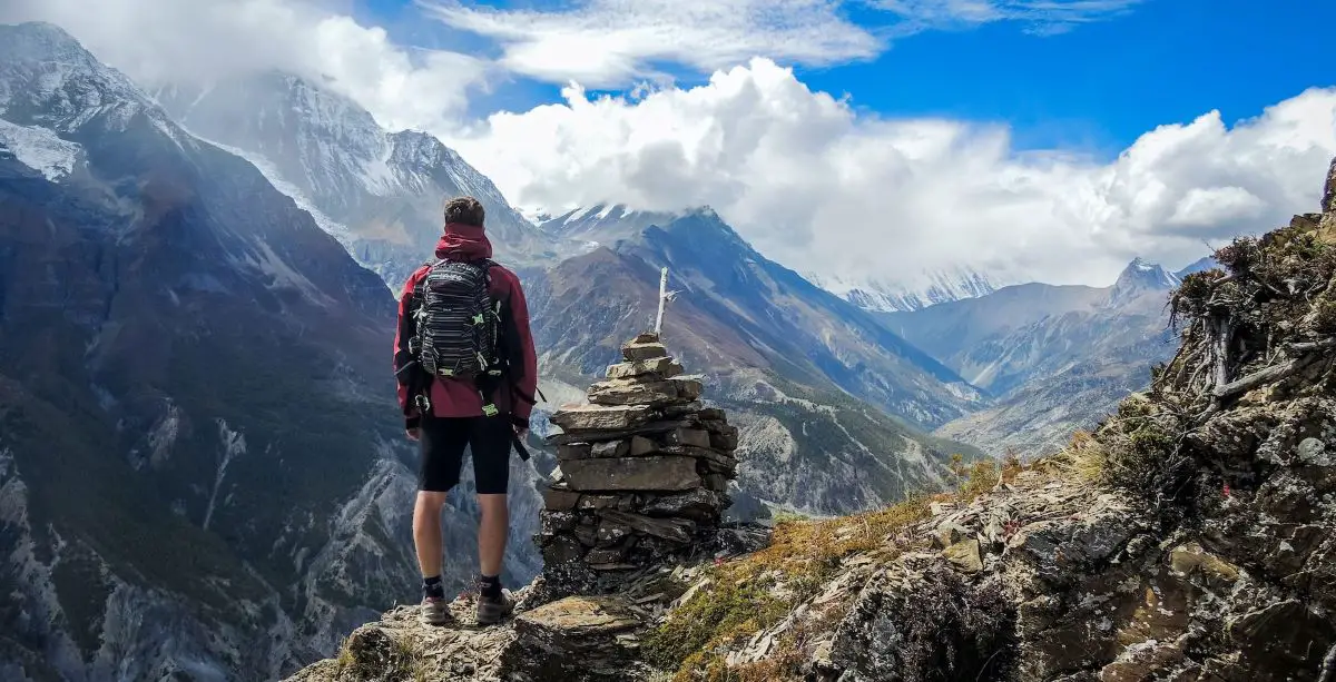Men standing on top of the mountains