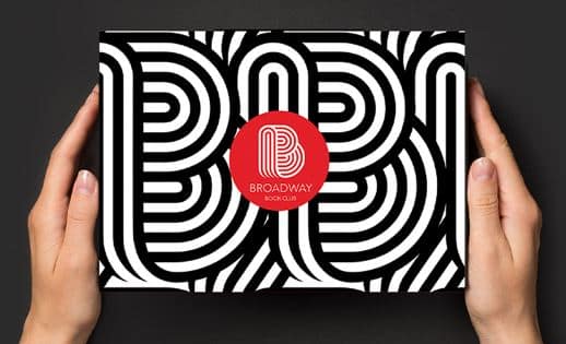 Someone holding a box with Broadway sticker