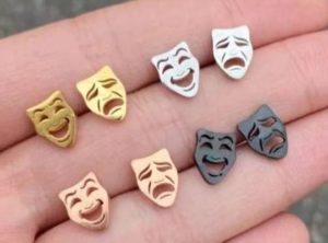 Four sets of earring studs with masks in different colors