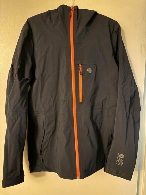 A black rain jacket from Mountain Hardwear
