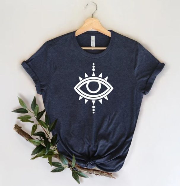 A black t-shirt with an icon of the evil eye