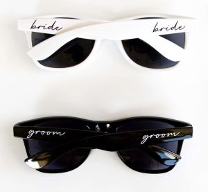 Matching sunglasses with "bride" and "groom"